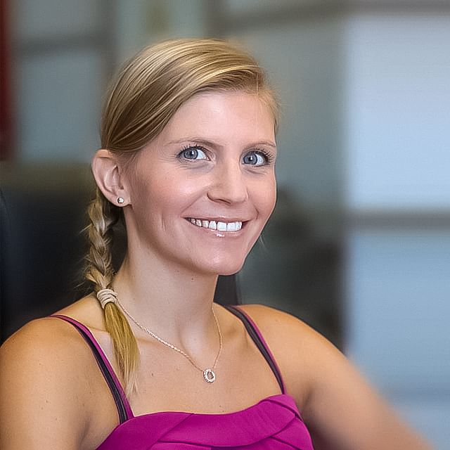 Jessica Fabre holding a testimonial